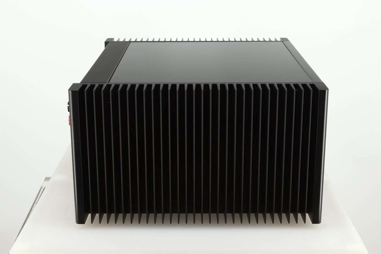 Left side view of a used Meridian 557 Power Amplifier in a black finish