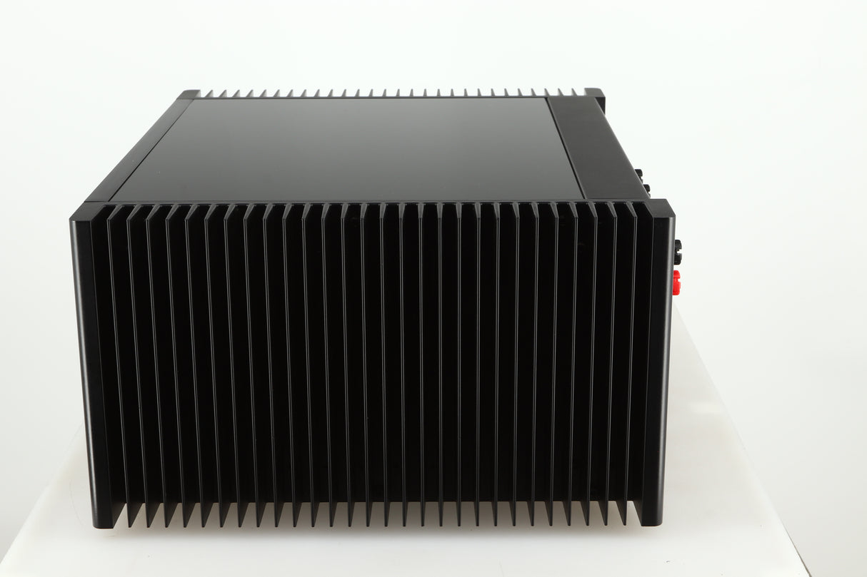 Right side view of a used Meridian 557 Power Amplifier in a black finish