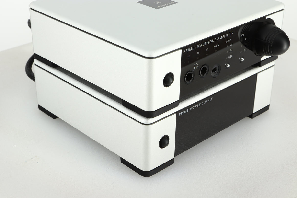 Front left view of a used Meridian Prime Headphone Amplifier and Power Supply in silver finish