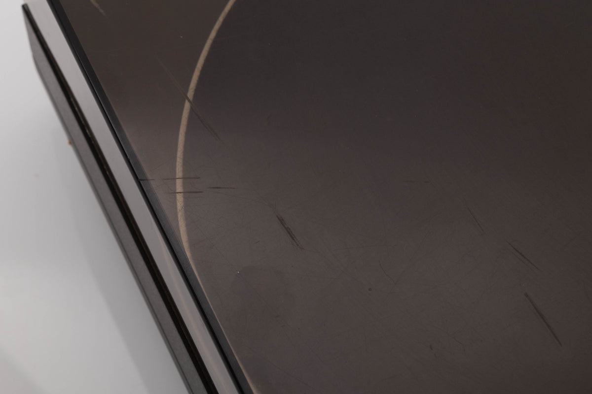 Close up view of a used Mission 775LC Turntable showing scratches on the lid