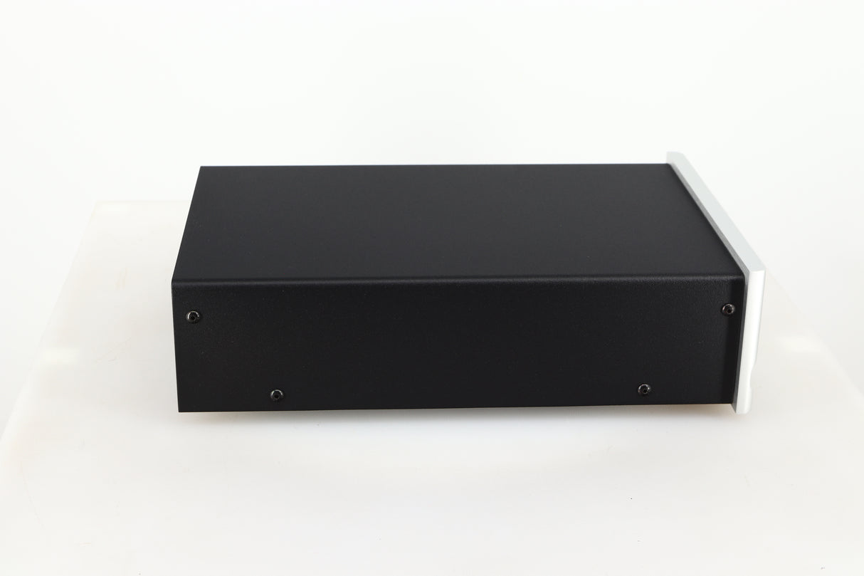 Left side view of a used Moon 320S Power Supply in a silver finish