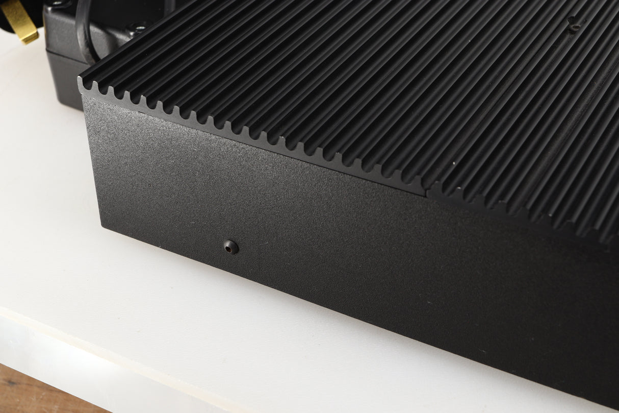 Close up of a used Musical Fidelity 3A Pre Amplifier in a black finish showing light scratching on left side