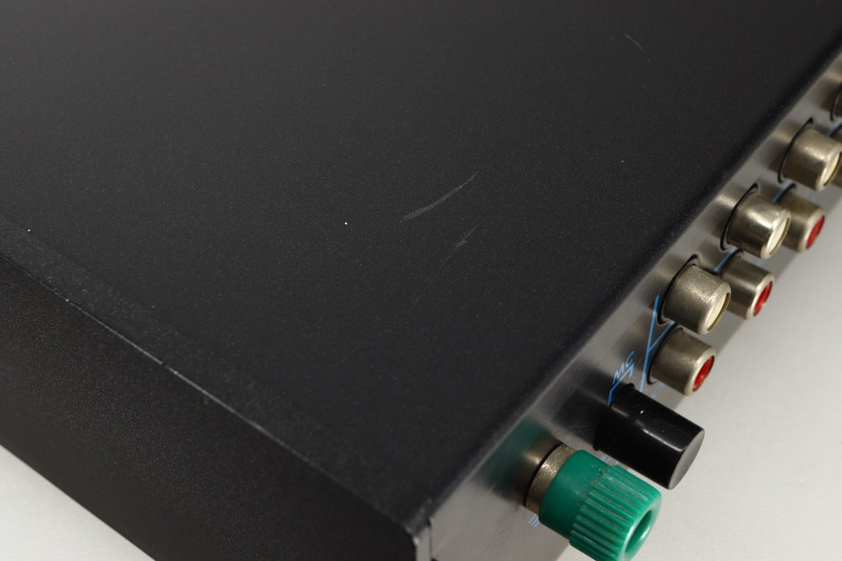 Close up view of a used Musical Fidelity B1 Integrated Amplifier showing scratching