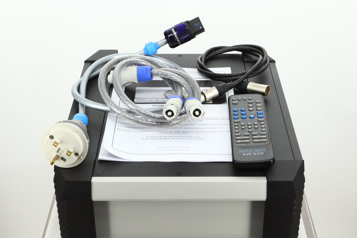 View of a used Musical Fidelity KW550 Integrated Amplifiers accessories showing mains cable, remote, and PSU cables