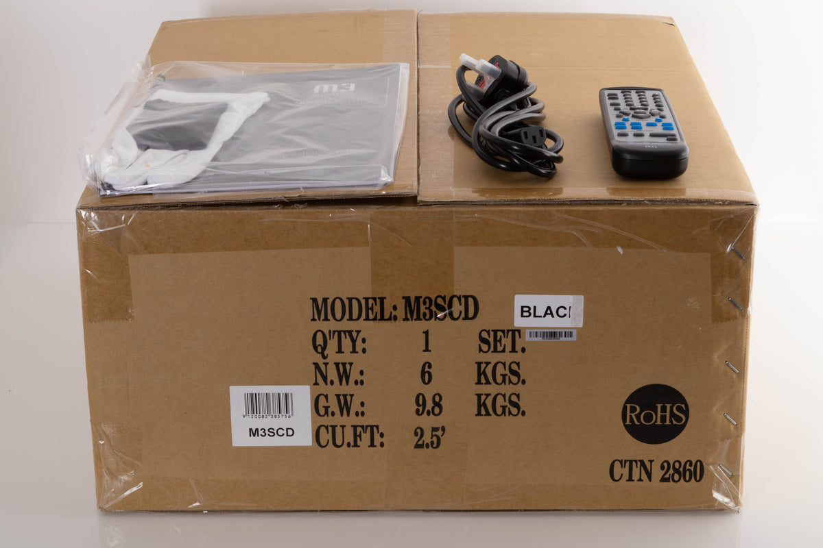 Box of a used Musical Fidelity M3SCD CD Player in Black with mains cable, manual, and remote
