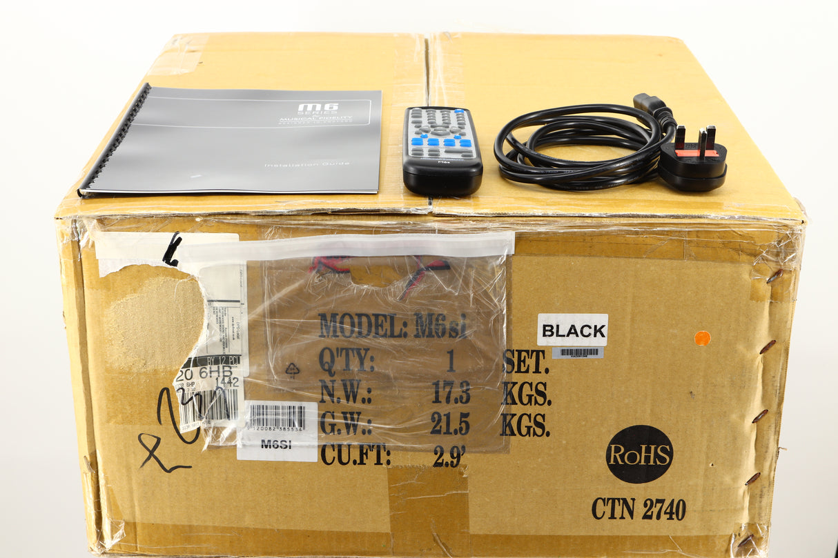 Box of a used Musical Fidelity M6si Integrated Amplifier in Black finish showing mains cable, manual, and remote