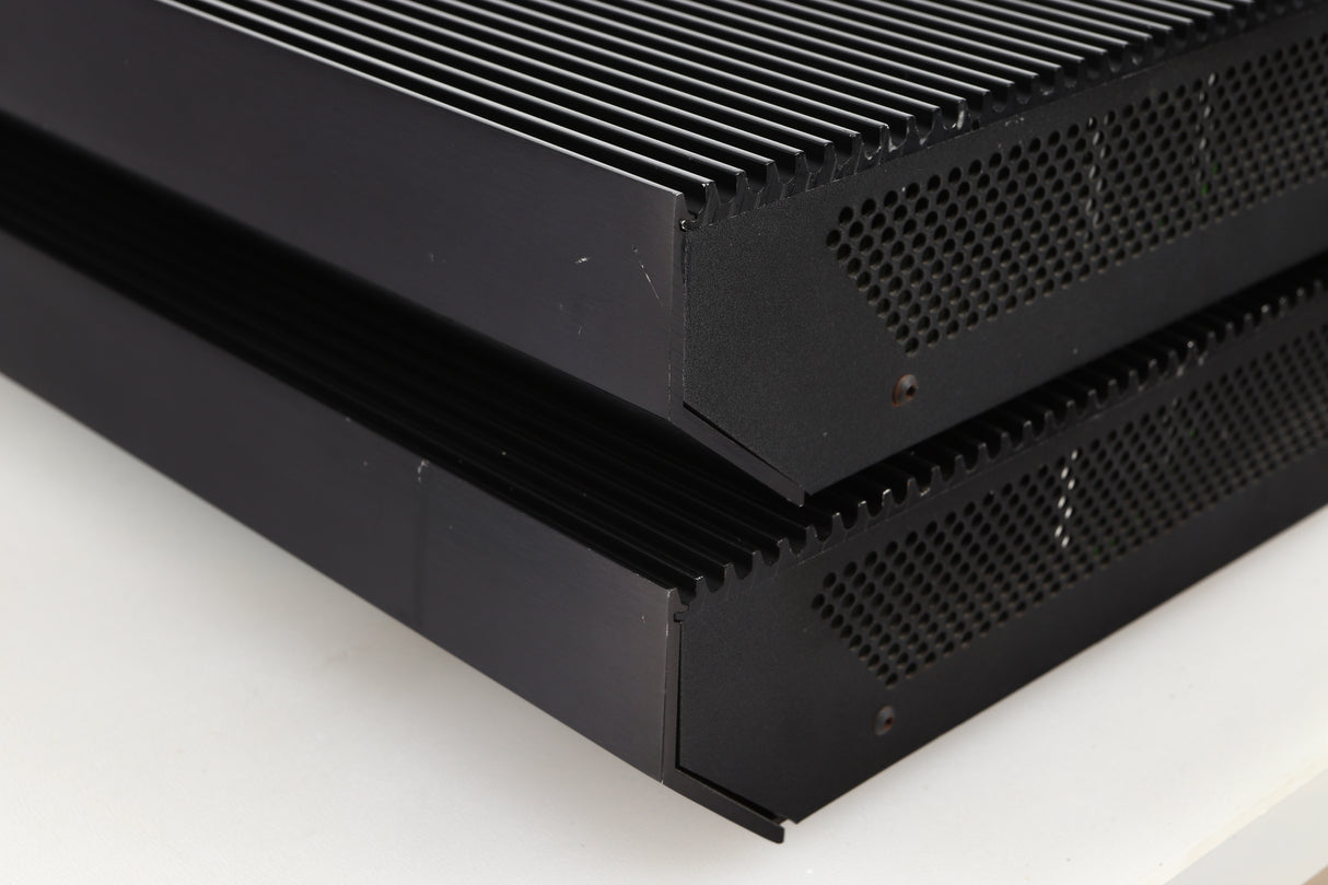 Front right corner view of a pair of used Musical Fidelity MA50 Class A Monoblock Power Amplifiers in Black finish