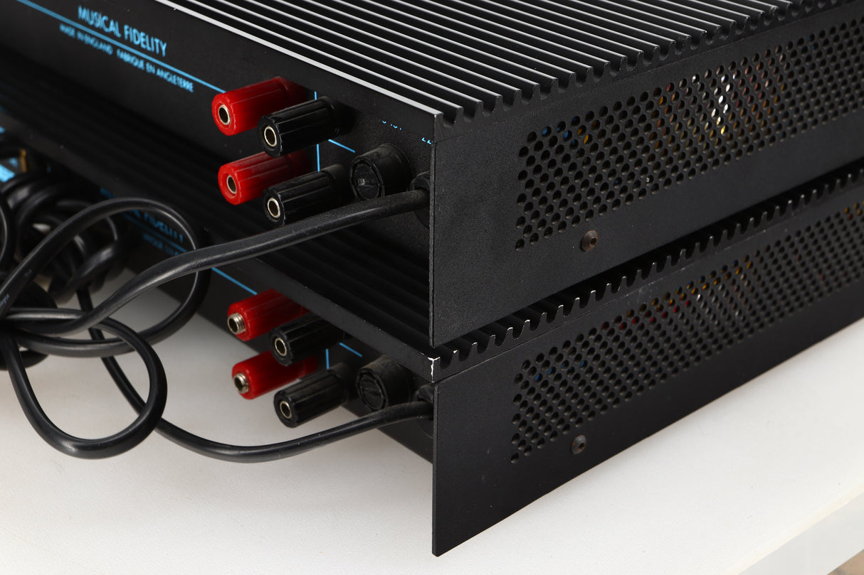 Rear right corner view of a pair of used Musical Fidelity MA50 Class A Monoblock Power Amplifiers in Black finish