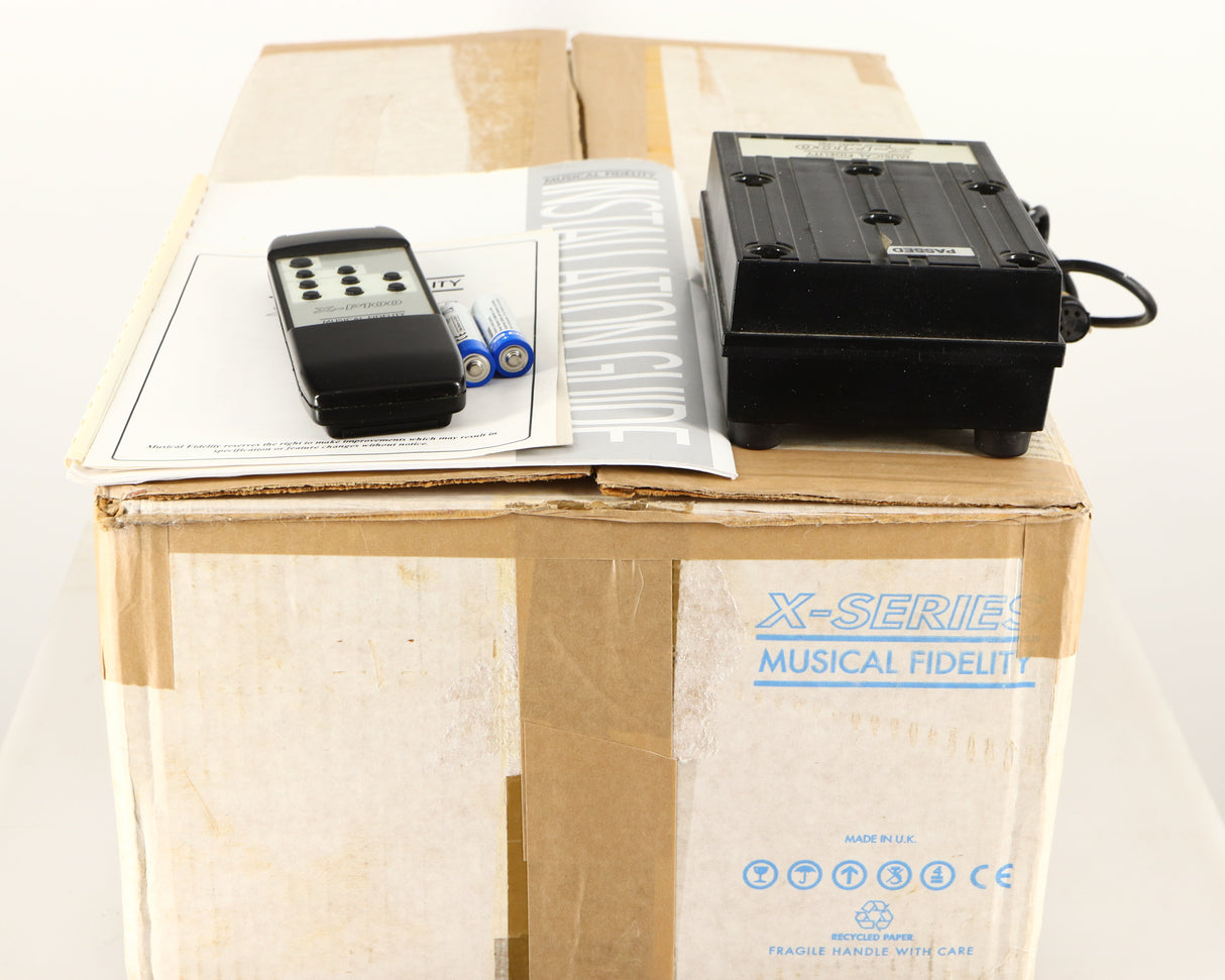 Box for a used Musical Fidelity X-P100 Pre Amplifier showing Remote, 2x Batteries, 2x Manuals and PSU