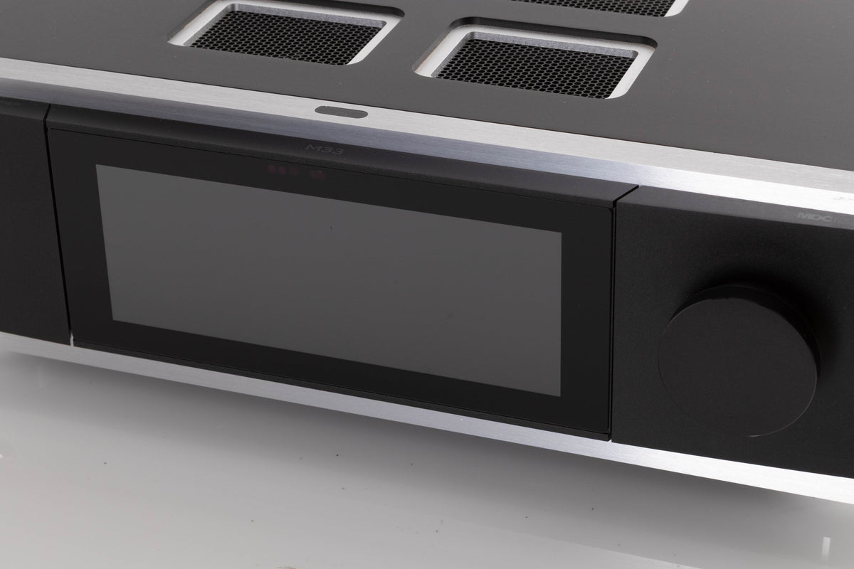 Close up of a used NAD M33 V1 BluOS Streaming DAC Integrated Amplifier showing screen