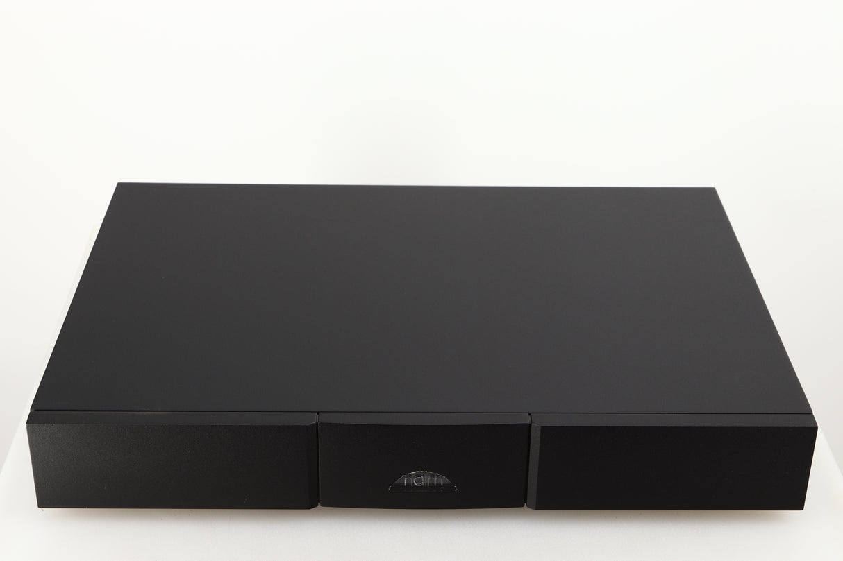 Top of a used Naim Flatcap 2X Power Supply in a black finish