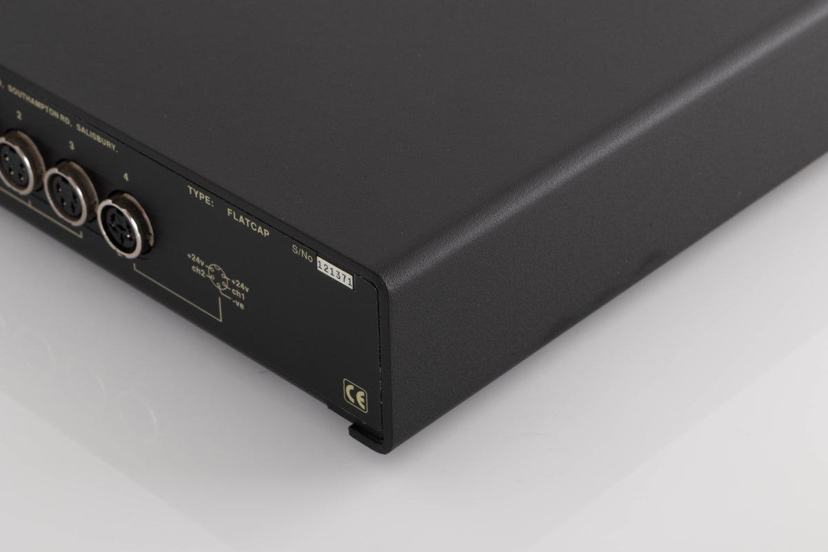 Rear left corner of a used Naim Flatcap Power Supply in a Black finish