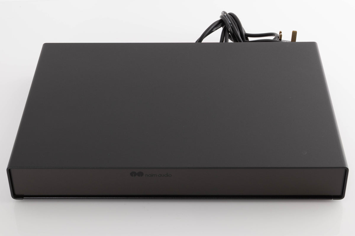 Top of a used Naim Flatcap Power Supply in a Black finish