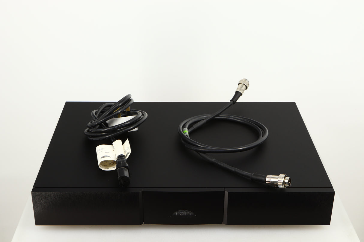 Top of a used Naim Flatcap XS Power Supply in a black finish showing Mains Cable and SNAIC5