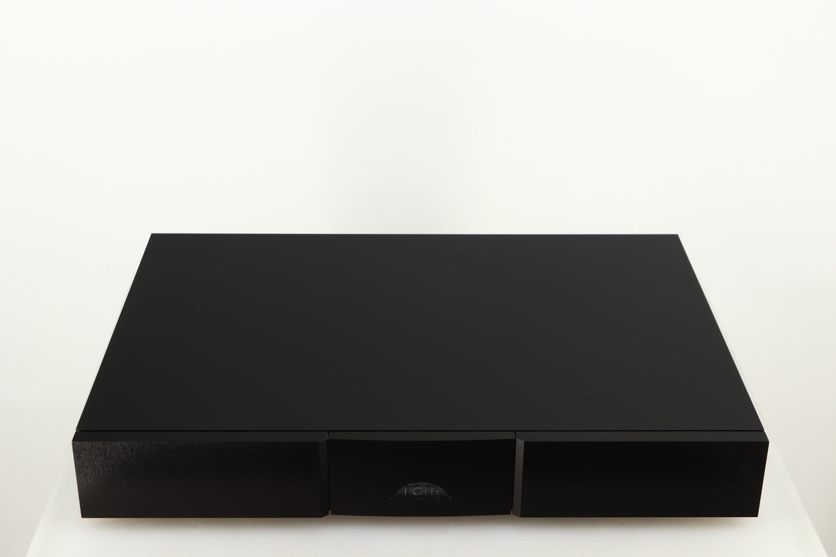 Top of a used Naim Flatcap XS Power Supply in a black finish