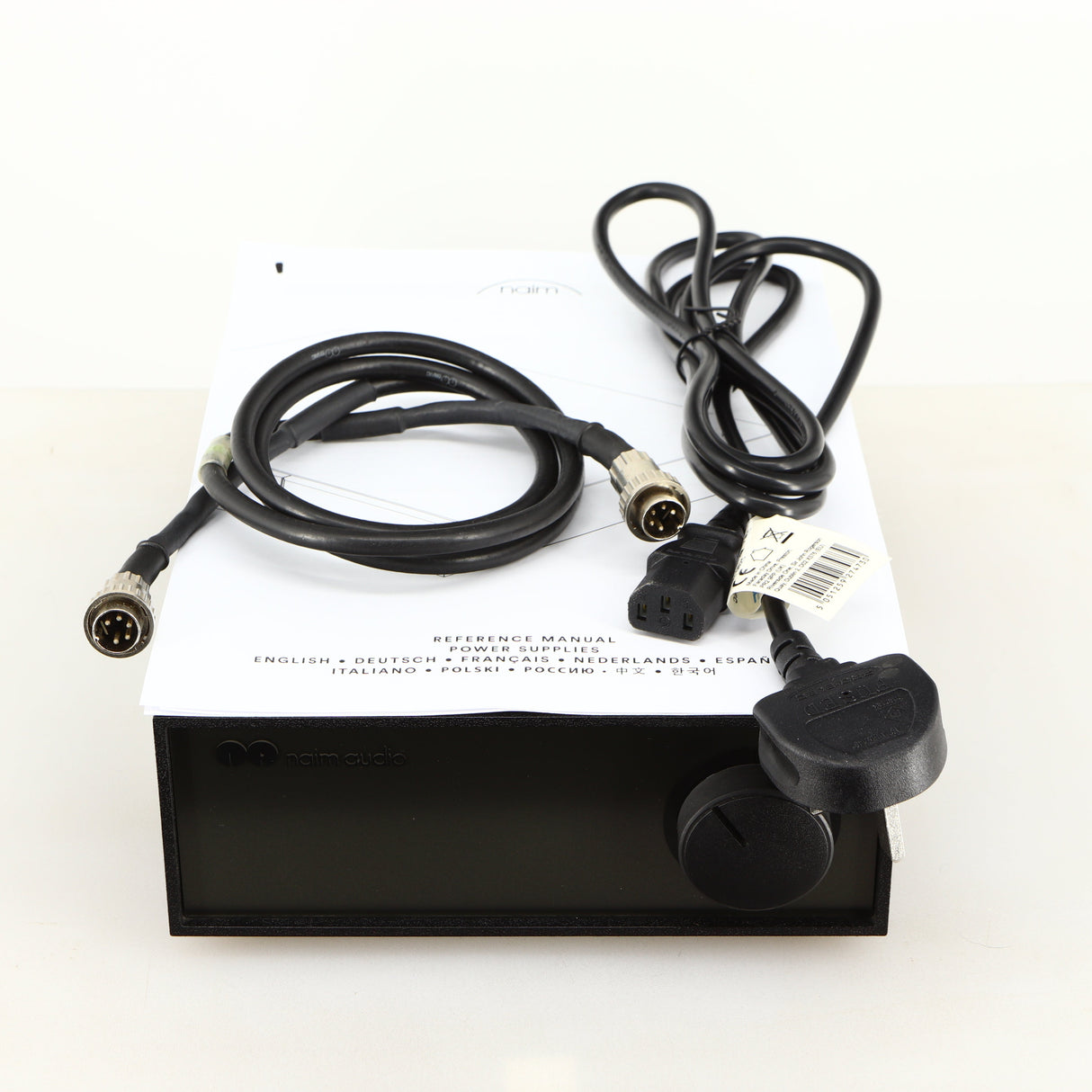 Top of a used Naim Hicap Power Supply in a black finish showing Mains Cable, SNAIC5 and Manual