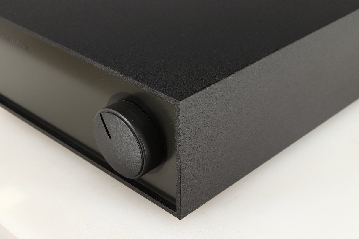 Front right corner of a used Naim Hicap Power Supply in a black finish