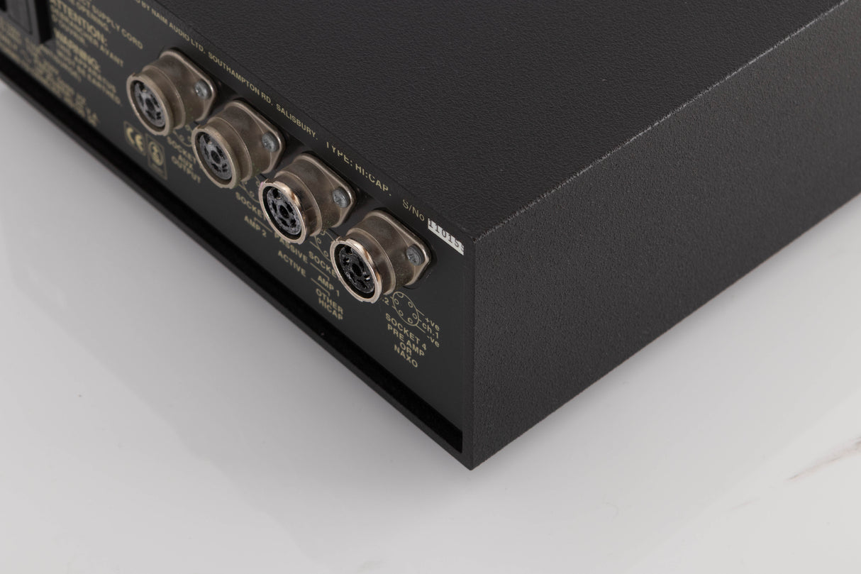 Rear left corner of a used Naim Hicap Power Supply in a Black finish