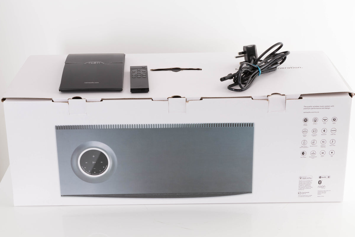 Box of a used Naim Mu-So GEN2 Wireless System with mains cable, manual, and remote