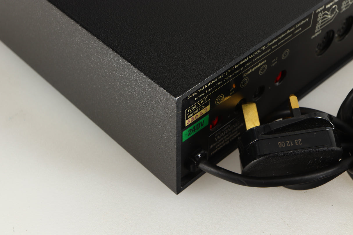 Rear right corner of a used Naim NAIT Integrated Amplifier in a black finish