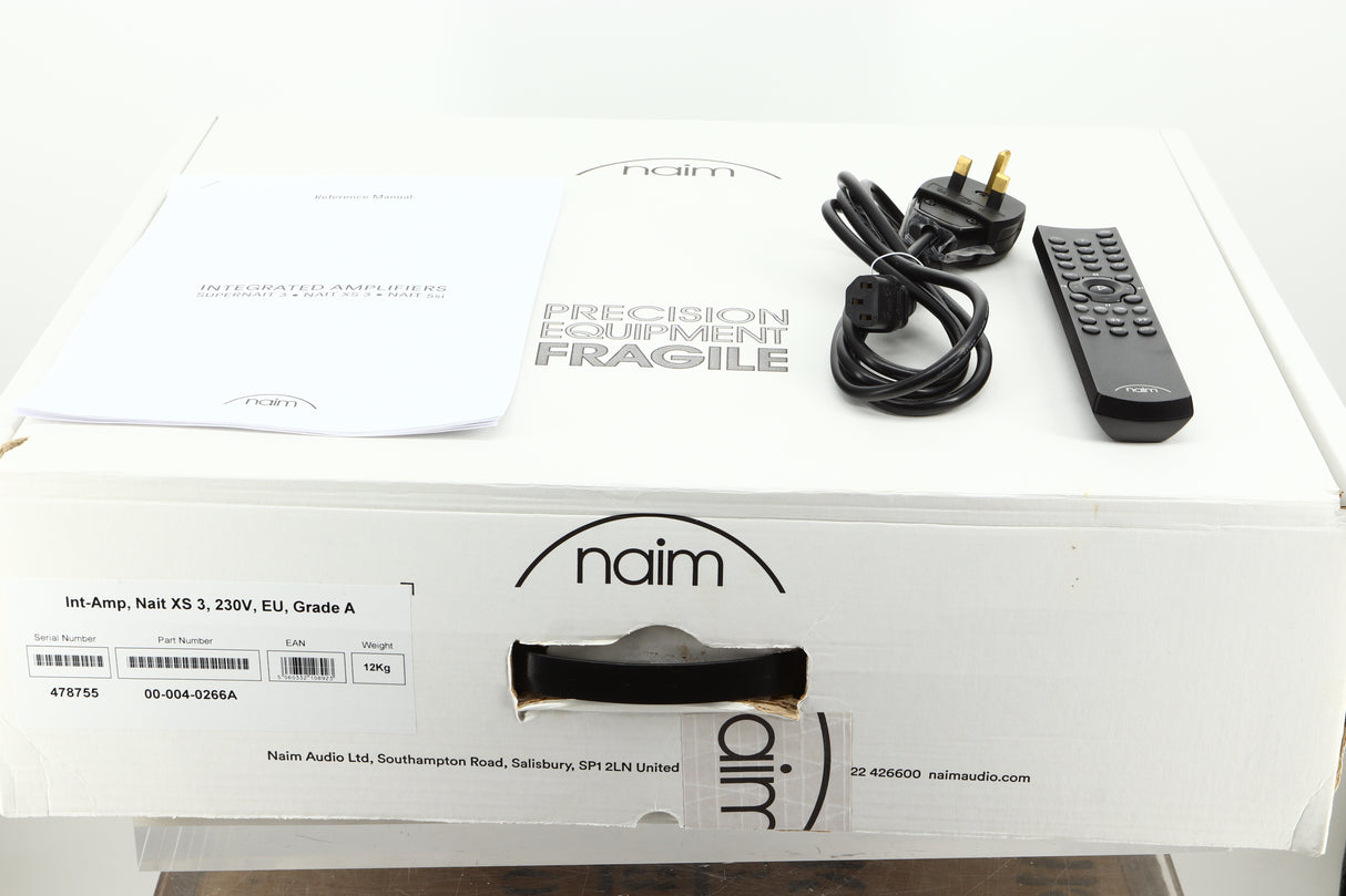 Box of a used Naim Nait XS-3 Integrated Amplifier showing mains cable, and remote
