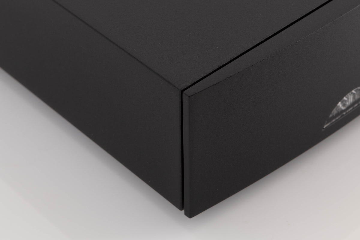 Front left corner of a used Naim NAP100 Power Amplifier in a Black finish