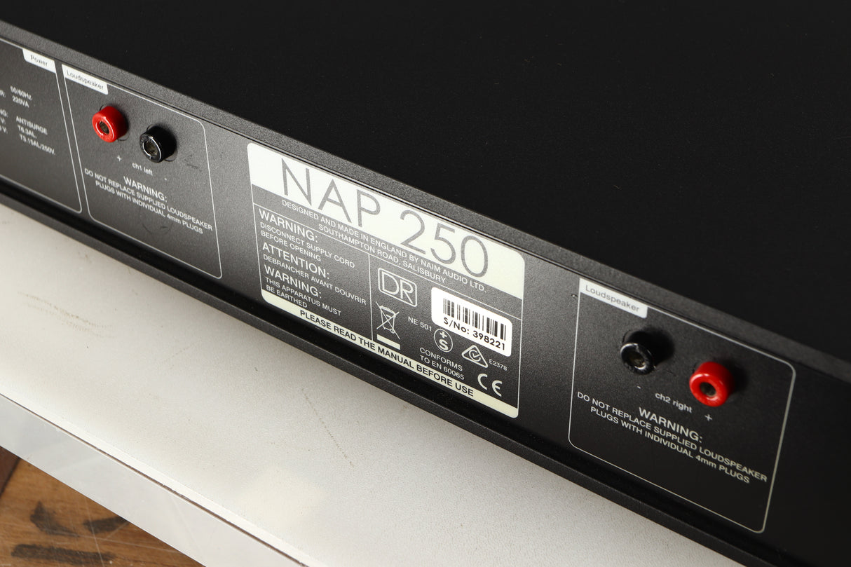 Close up of a used Naim NAP250 DR Power Amplifier in a black finish showing scratching on rear