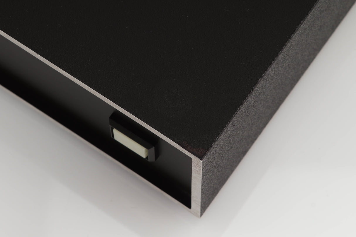 Close up of a used Naim NAP250 Power Amplifier in a black finish showing small blemish and foot mark on top
