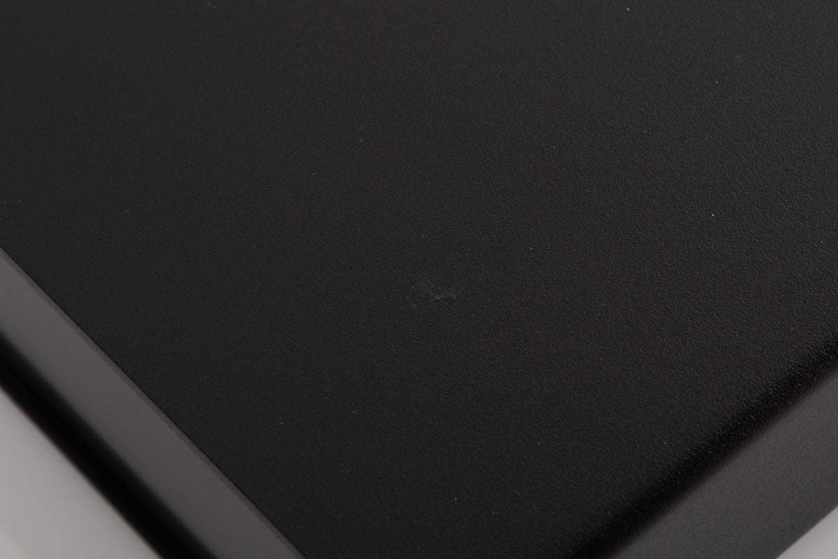 Close up of a used Naim NAP90 Power Amplifier in a Black finish showing mark and scratches on top