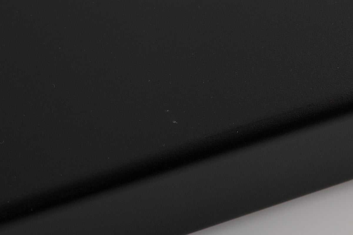 Close up of a used Naim NAT03 FM Tuner in a Black finish showing scratches on right side edge
