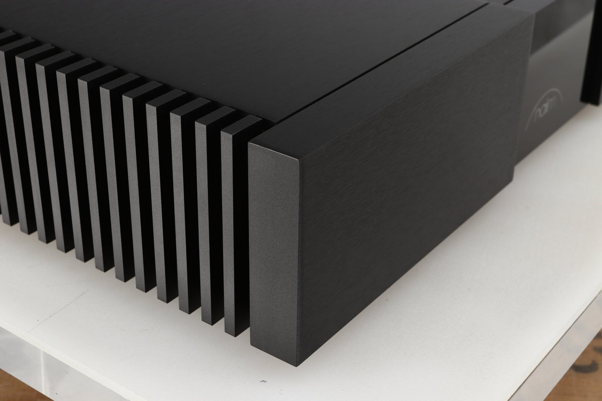 Front left corner of a used Naim NPX300 Power Supply in a black finish