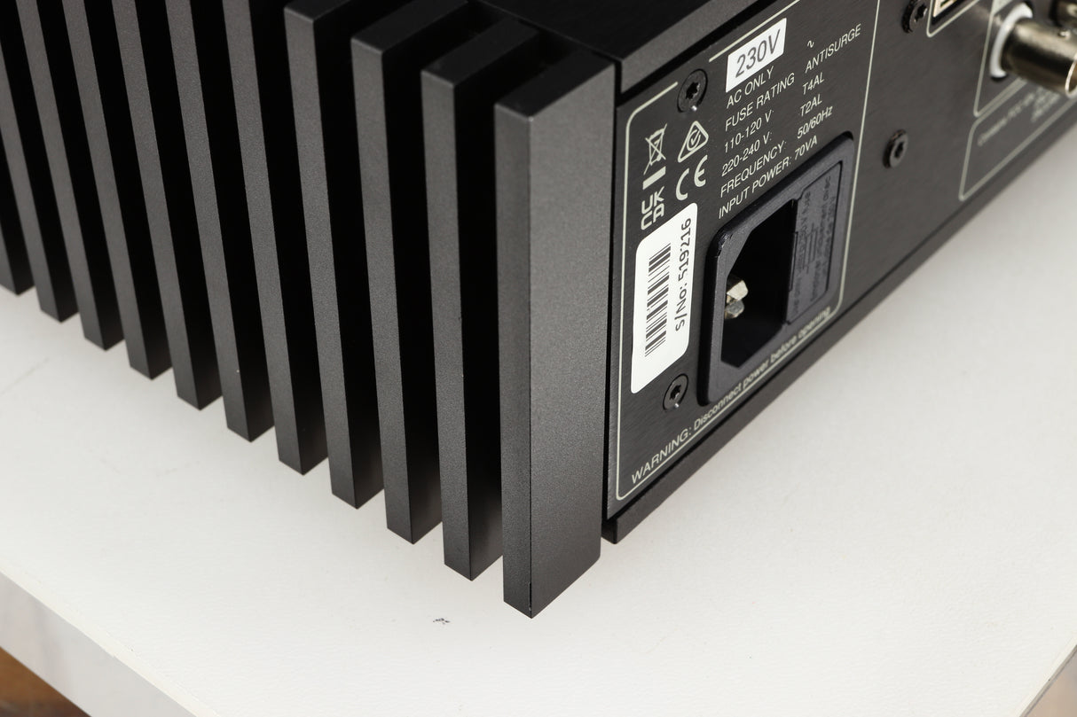Close up of a used Naim NSC222 Pre Amplifier in a black finish showing small scratch on rear right corner