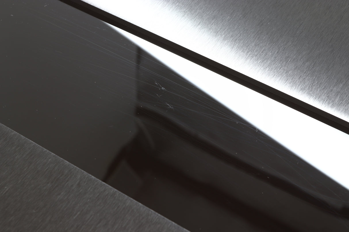 Close up view of a used Naim NSS333 Streamer showing scratches on the top gloss section
