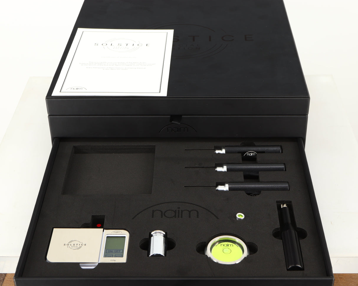 Box for a used Naim Dust Protector and Manual in a black finish showing 4x Screwdrivers, Stylus Gauge, Authentication Certificate and 2x Spirit Levels