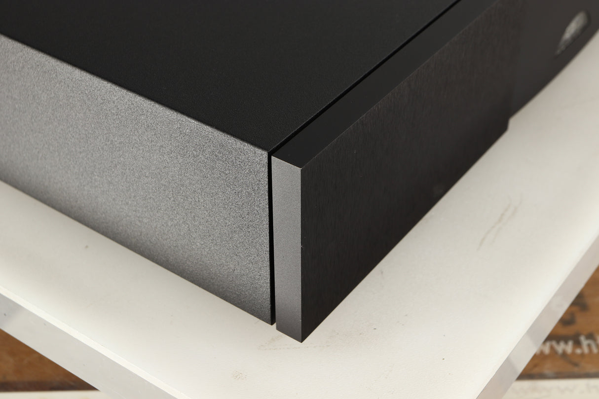 Front left corner of a used Naim Supercap DR Power Supply in a black finish