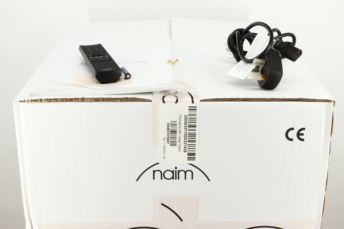 Box for a used Naim Supernait 3 Integrated Amplifier in a black finish showing Manual, Remote, 3x Batteries and Mains Cable