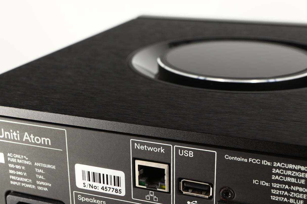 Close up of a used Naim Uniti Atom HDMI Integrated System in a black finish showing light scratching on rear