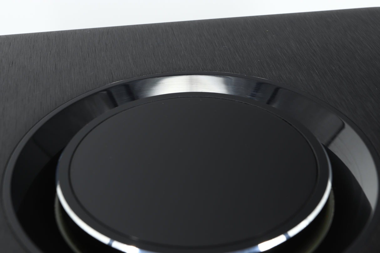 Close up view of a used Naim Uniti Atom HDMI Streaming Amplifier showing scratching on the gloss surface around the dial