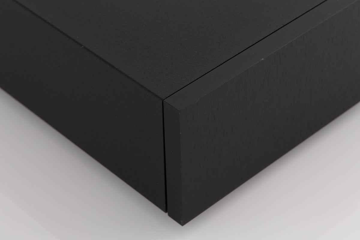 Front left corner of a used Naim XPS-2 Power Supply in a Black finish