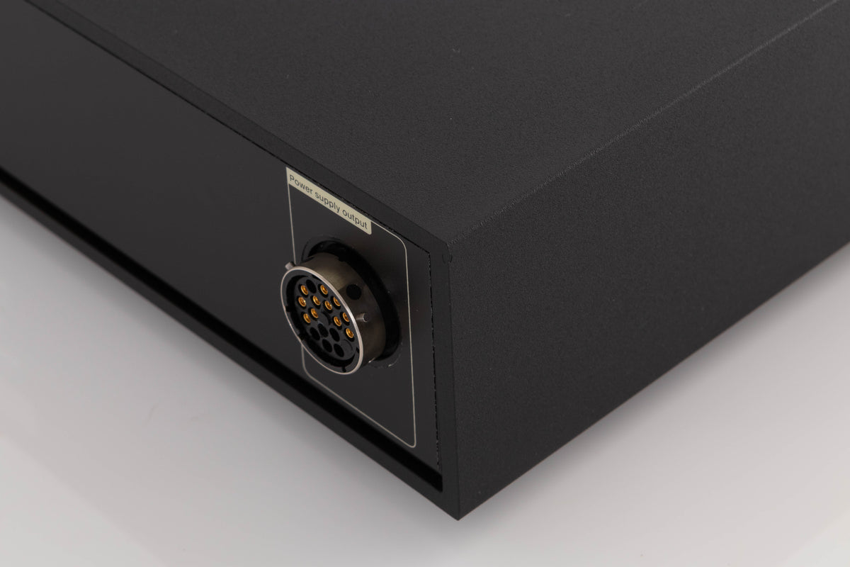 Rear left corner of a used Naim XPS-2 Power Supply in a Black finish