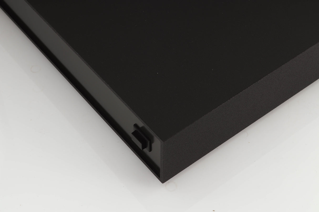 Front right corner of a used Naim XPS Power Supply in a black finish
