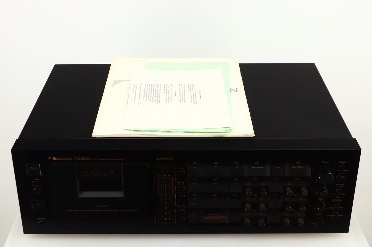 Top of a used Nakamichi Dragon Cassette Deck in a black finish showing Manual