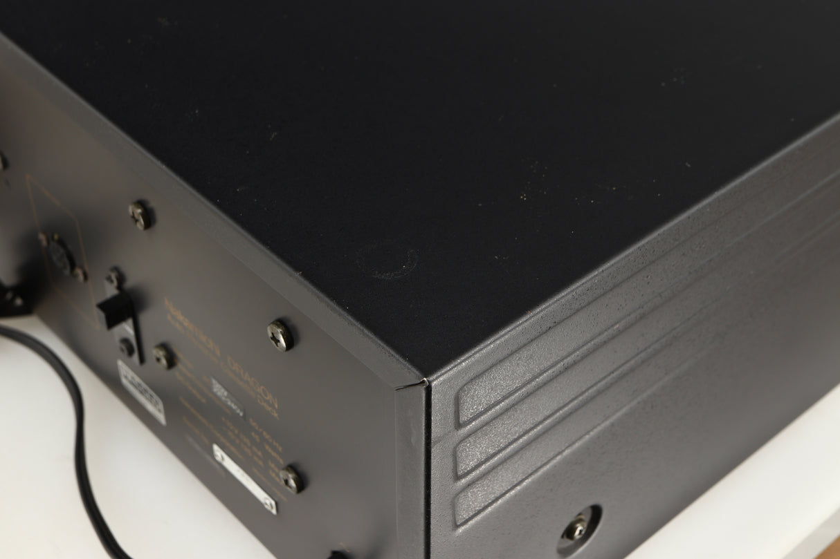 Close up of a used Nakamichi Dragon Cassette Deck in a black finish showing some marks