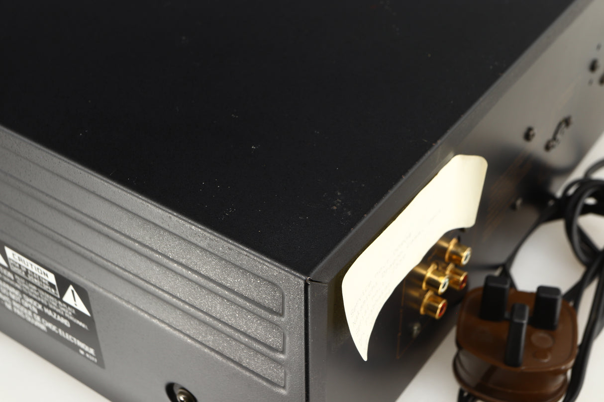 Close up of a used Nakamichi Dragon Cassette Deck in a black finish showing some marks