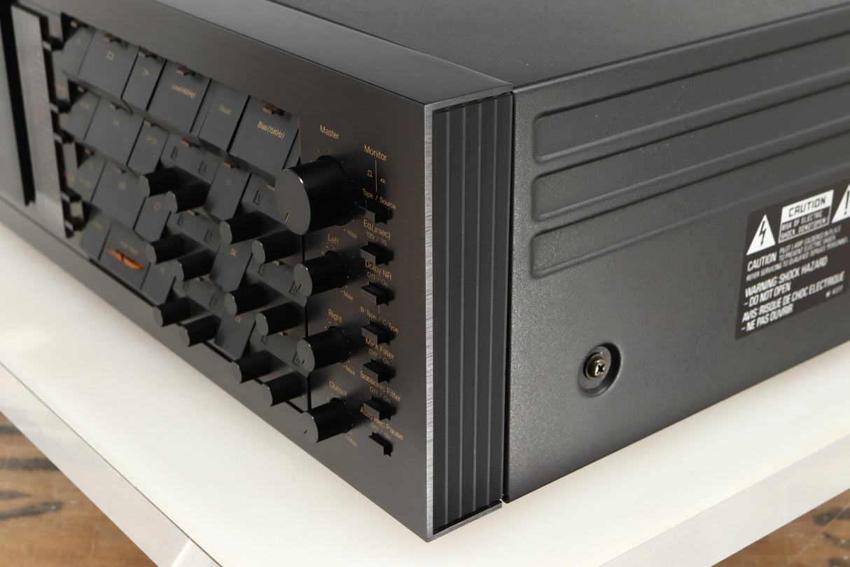 Front right corner of a used Nakamichi Dragon Cassette Deck in a black finish