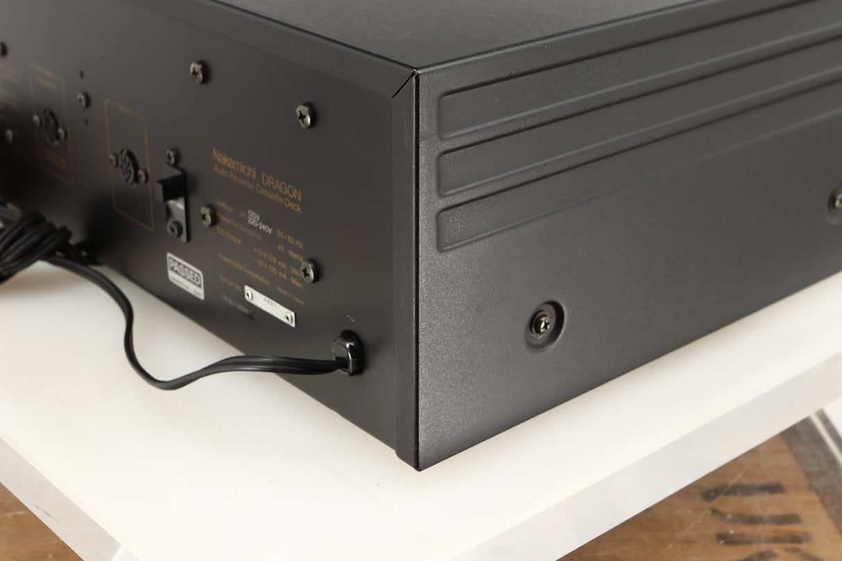 Rear left corner of a used Nakamichi Dragon Cassette Deck in a black finish