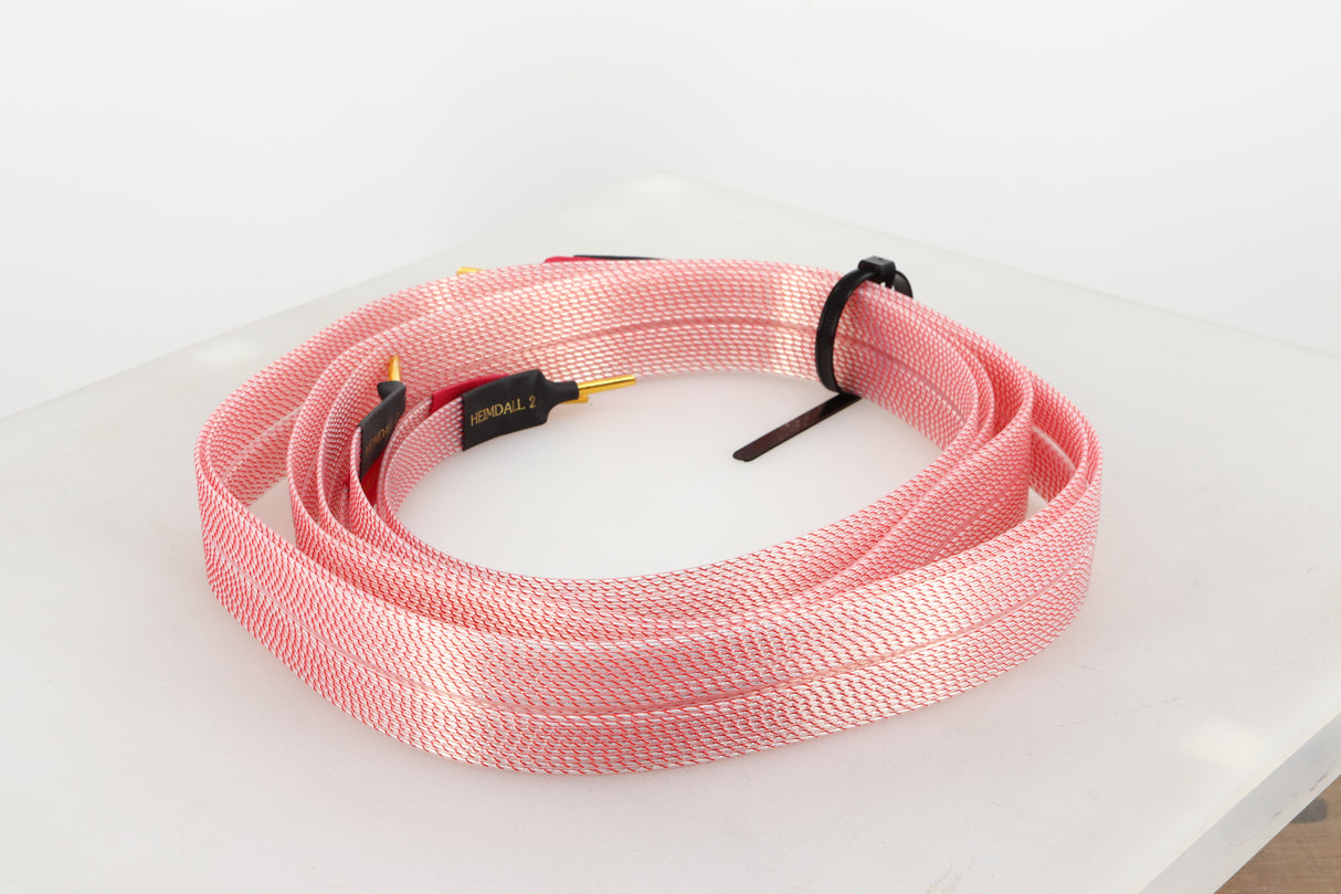 Rear right angle of a used Nordost Heimdall 2 Speaker Cables 2.0m Pair in a pink finish