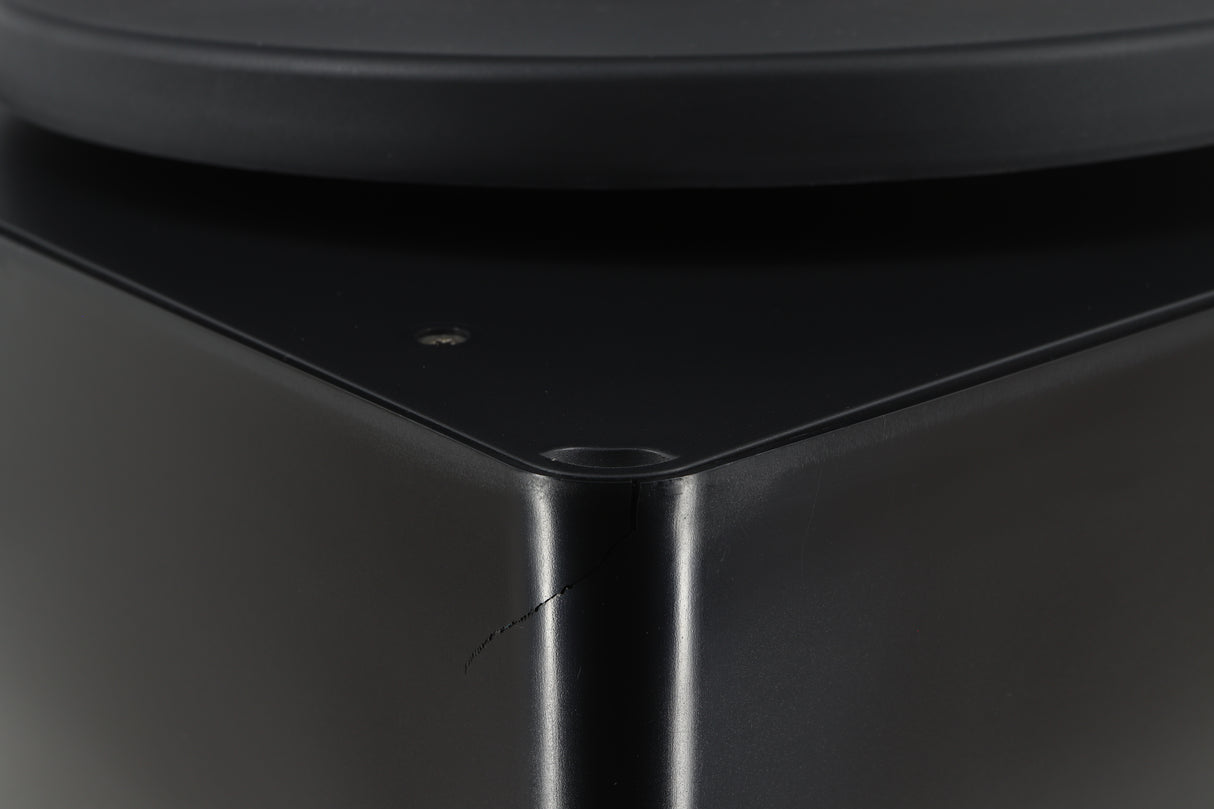 Close up of a used Okki Nokki One Record Cleaning Machine in a black finish showing a crack