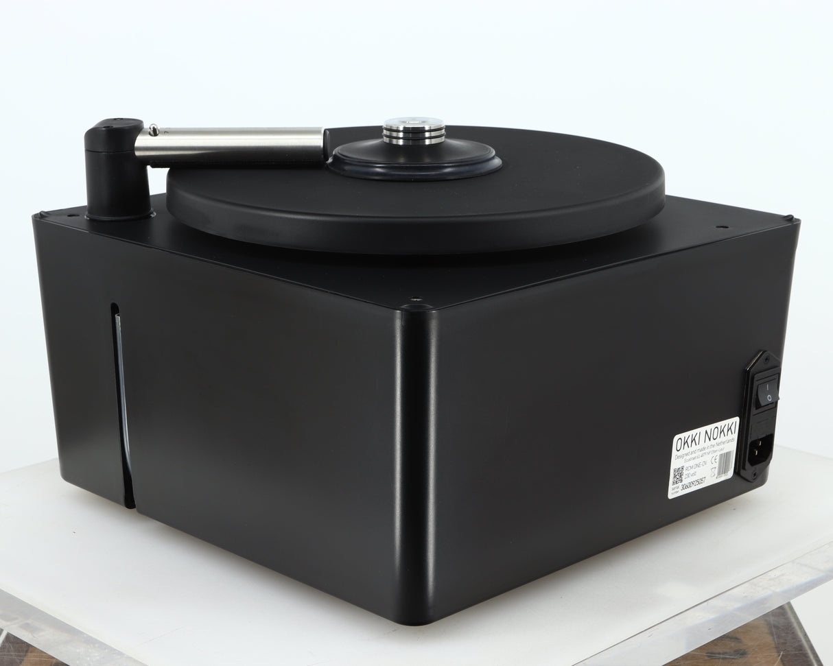 Rear right corner of a used Okki Nokki One Record Cleaning Machine in a black finish