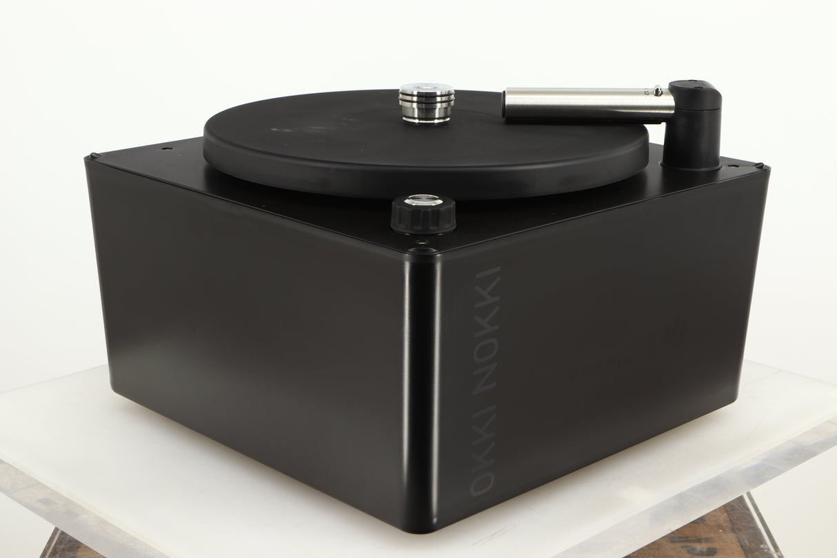 Front left corner of a used Okki Nokki One Record Cleaning Machine in a black finish